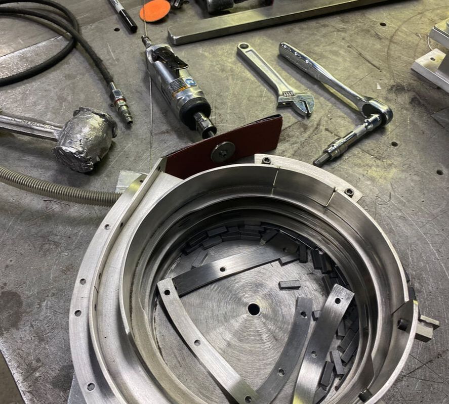 A custom vibratory bowl feeder in the process of being built.